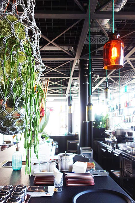 Plants create urban jungle at Berlin hotel by Studio Aisslinger