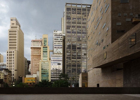 Praca das Artes by Brasil Arquitetura features concrete boxes projecting over a public plaza