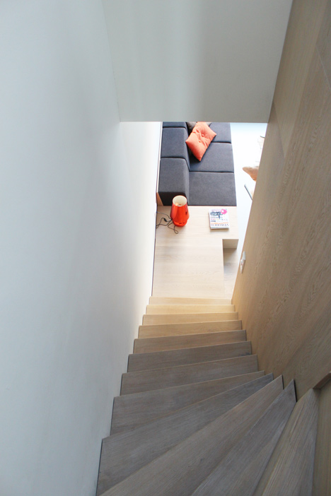 8A Architecten renovate house with combined staircase and sofa