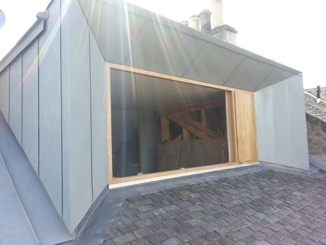 Zinc-clad loft extension by Konishi Gaffney creates an extra bedroom