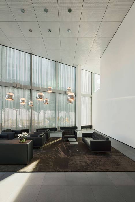 Allianz Headquarters by Wiel Arets features glass fritted to resemble Mies' Barcelona Pavilion