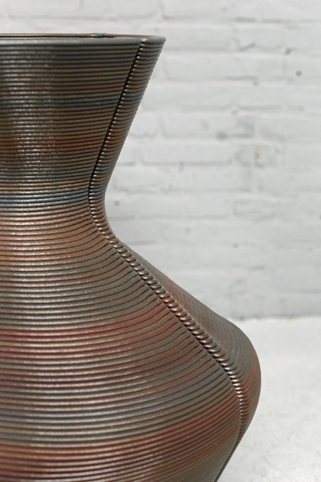 Dirk Vander Kooij uses a robotic arm to print vases from scrap plastic