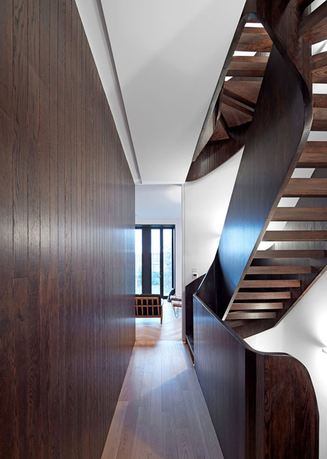 Curvacious oak staircase ascends through converted London convent by John Smart Architects