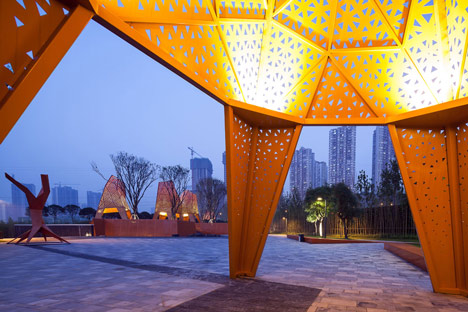 Four-legged perforated metal pavilions rise above Fengming Mountain Park