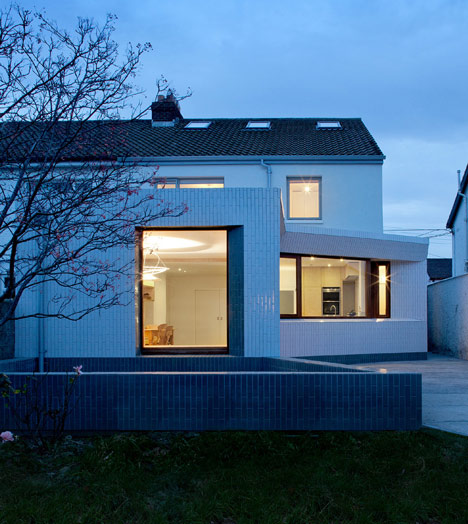 Tile-covered walls reflect light into Greenlea Road extension by GKMP Architects