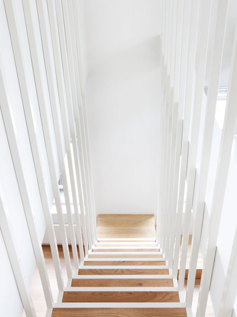 Floating steel staircase divides Haptic's Idunsgate Apartment in Oslo