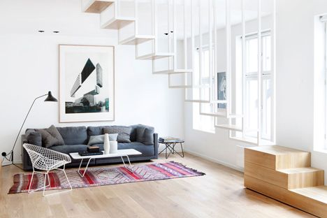 Floating steel staircase divides Haptic's Idunsgate Apartment in Oslo