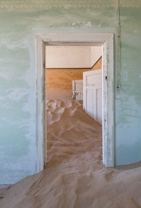 Ghost town engulfed by mounds of sand<br /> photographed by Romain Veillon