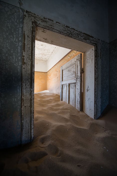 Ghost town engulfed by mounds of sand<br /> photographed by Romain Veillon