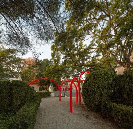 Luminous red arches by LIKEarchitects installed at Portuguese palace