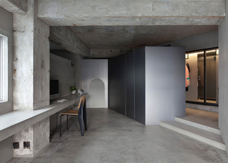 Bare concrete apartment by Airhouse Design Office presents its own fashion exhibitions