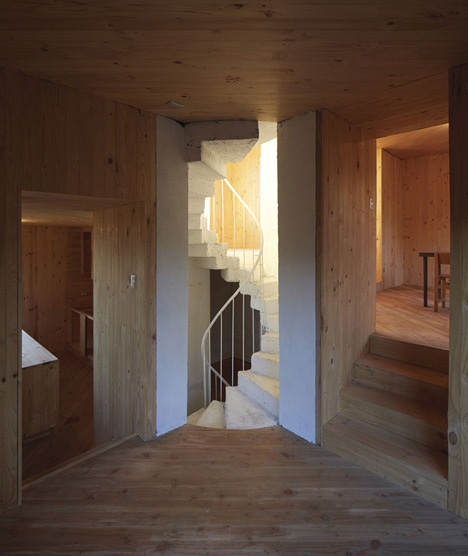 Concrete staircase spirals up through Pezo von Ellrichshausens Casa Gago