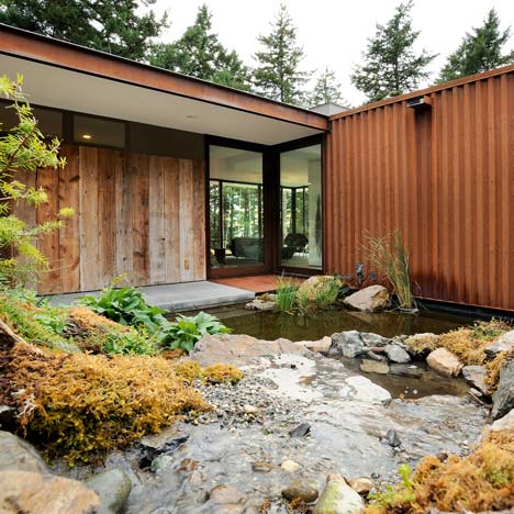 Eagle Ridge Residence by Gary Gladwish frames a rockery and pond