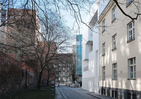 Balconies sit within angular openings at Atelier Zafari's Berlin apartment block