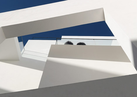 Balconies sit within angular openings at Atelier Zafari's Berlin apartment block