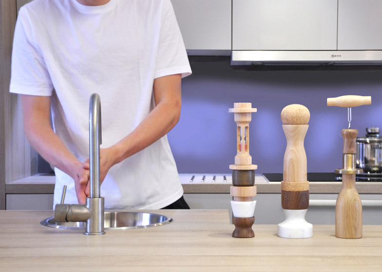 Oliver Richardson stacks kitchen utensils into miniature totem poles