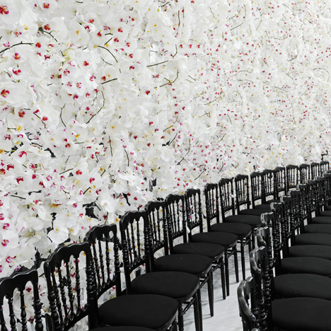 Dior's feminine haute couture fashion show set against white orchids
