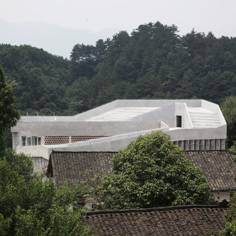 Hospital for a rural Chinese community features a ramp that slopes up to the roof