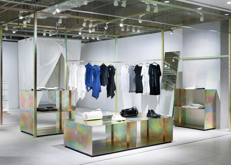 Schemata Architects refits Japanese store with petrol-hued display