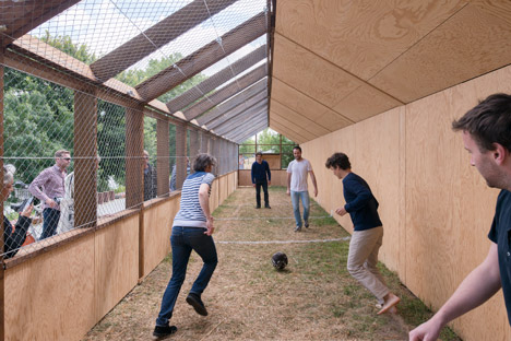 Guinée*Potin Architectes creates "footcheball" playground inside a thatched shed