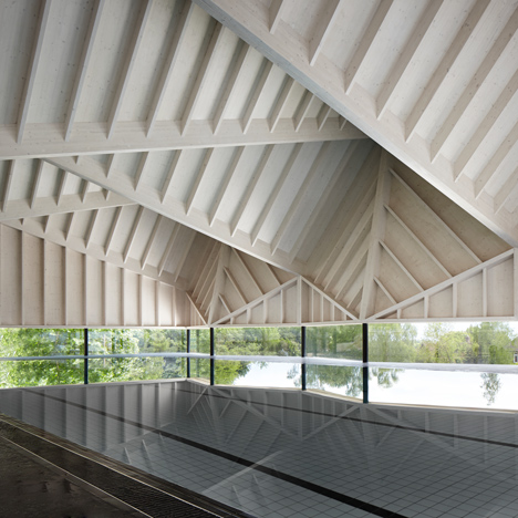 Angular wooden roof reduces sound reverberation inside swimming pool by Duggan Morris