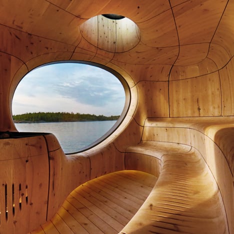 Lakeside sauna by Partisans designed as a cavernous wooden grotto