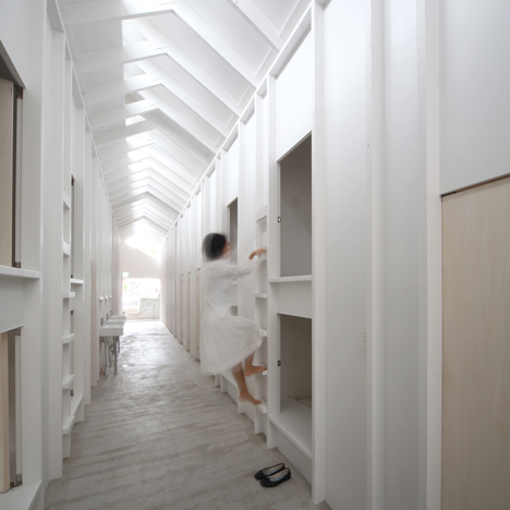 Ladders lead to capsule-sized bedrooms in Koyasan Guesthouse by Alphaville