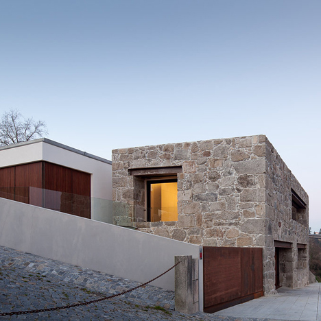 FCC Arquitectura slots family home within&ltbr /&gt stone walls of dilapidated farmhouse