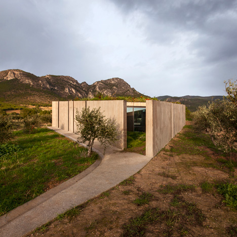 Tense Architecture Network completes a "frugal" concrete home in a Greek olive grove
