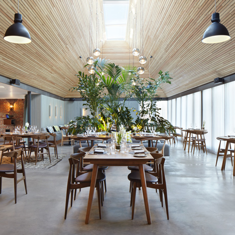 Softroom converts thatched-roof pub into contemporary restaurant and cookery school