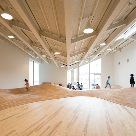 Community centre by Kengo Kuma features&ltbr /&gt playrooms with undulating floorboards