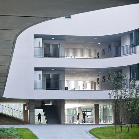 Open Architecture completes a "free-form" Beijing school surrounded by gardens