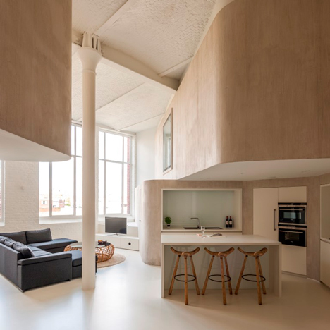 Graux & Baeyens uses curved walls to convert a factory loft into a family home