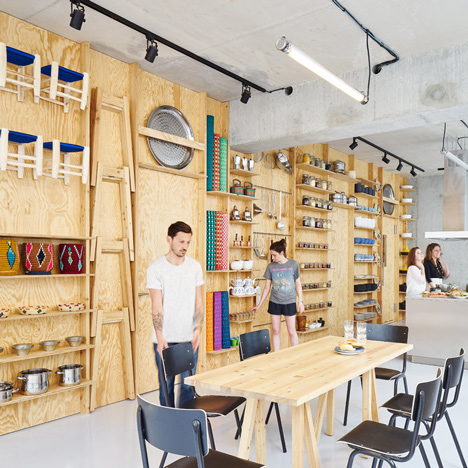 Tools and furniture hook onto a plywood wall in Paris cookery classroom by Septembre