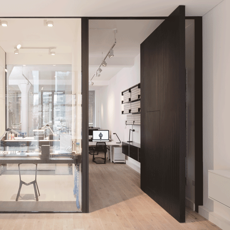Uniform Wares offices include a glazed watch-prototyping room and a pivoting timber door