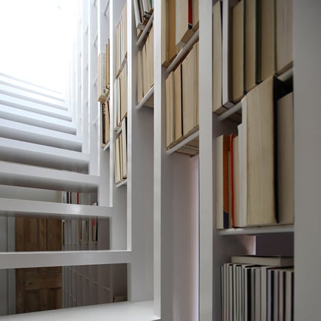 Staircase doubles as a bookcase in London loft conversion by Tamir Addadi Architecture