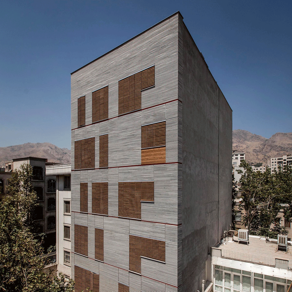 Ayeneh Office gives Tehran apartments a textured facade with ridged granite and slatted timber
