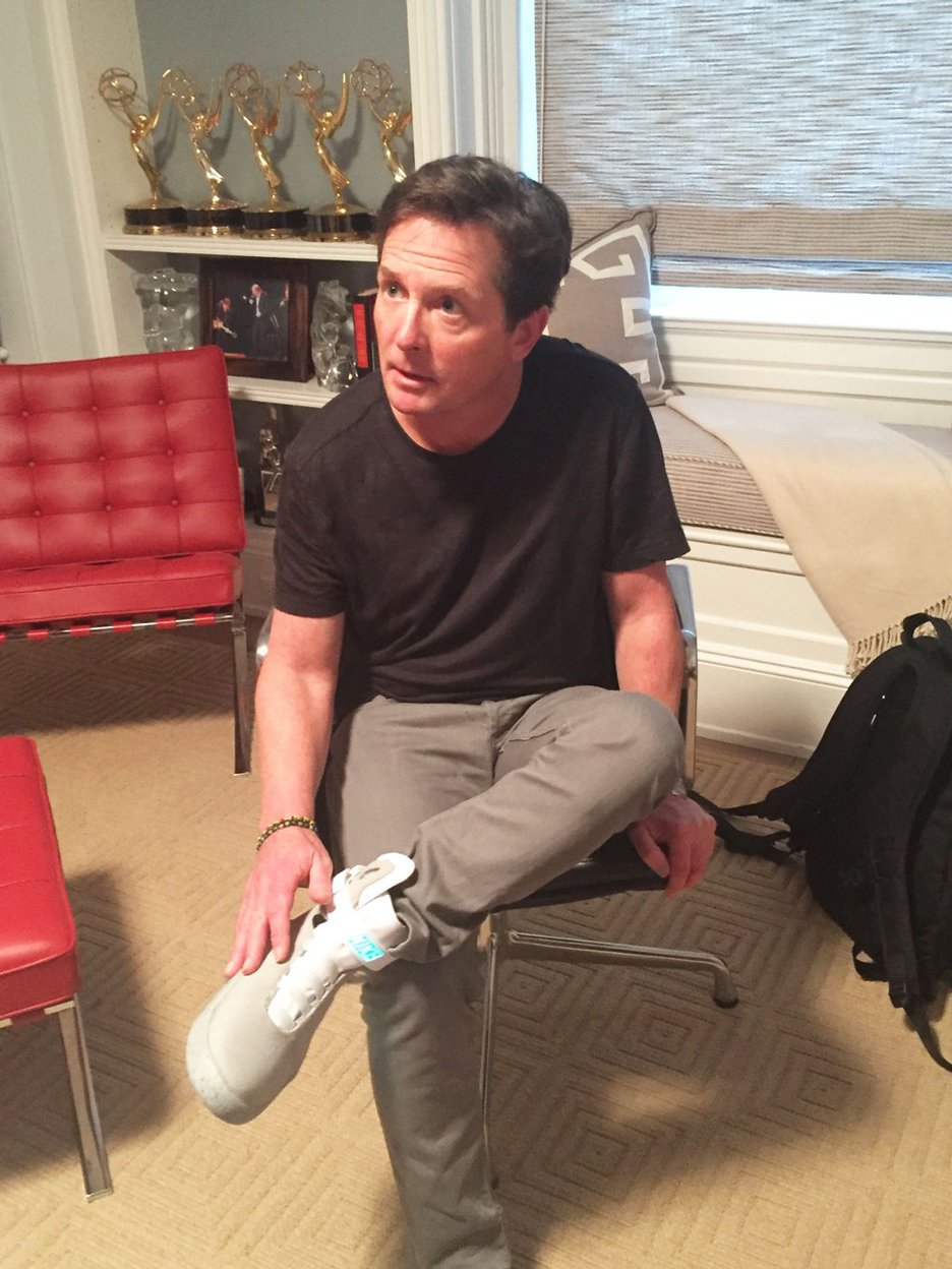 Michael Fox tries on first pair Back to the Future Nike shoes