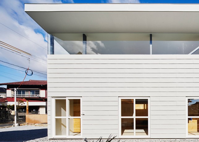 House By Syap Has A Roof Angled Upwards Like The Lid Of A Box