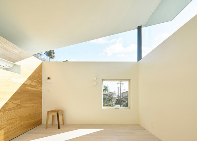 House By Syap Has A Roof Angled Upwards Like The Lid Of A Box