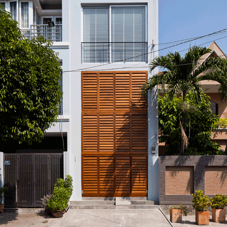 Vietnamese shophouse by MM++ Architects features a facade that folds open