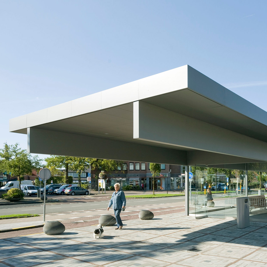 Huge steel roof oversails glazed waiting area at Barneveld Centrum station by NL Architects