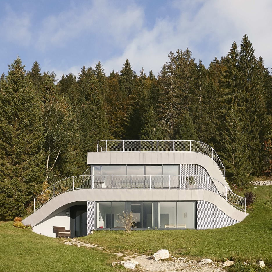 French villa designed by Julien De Smedt to look like a bump in the landscape