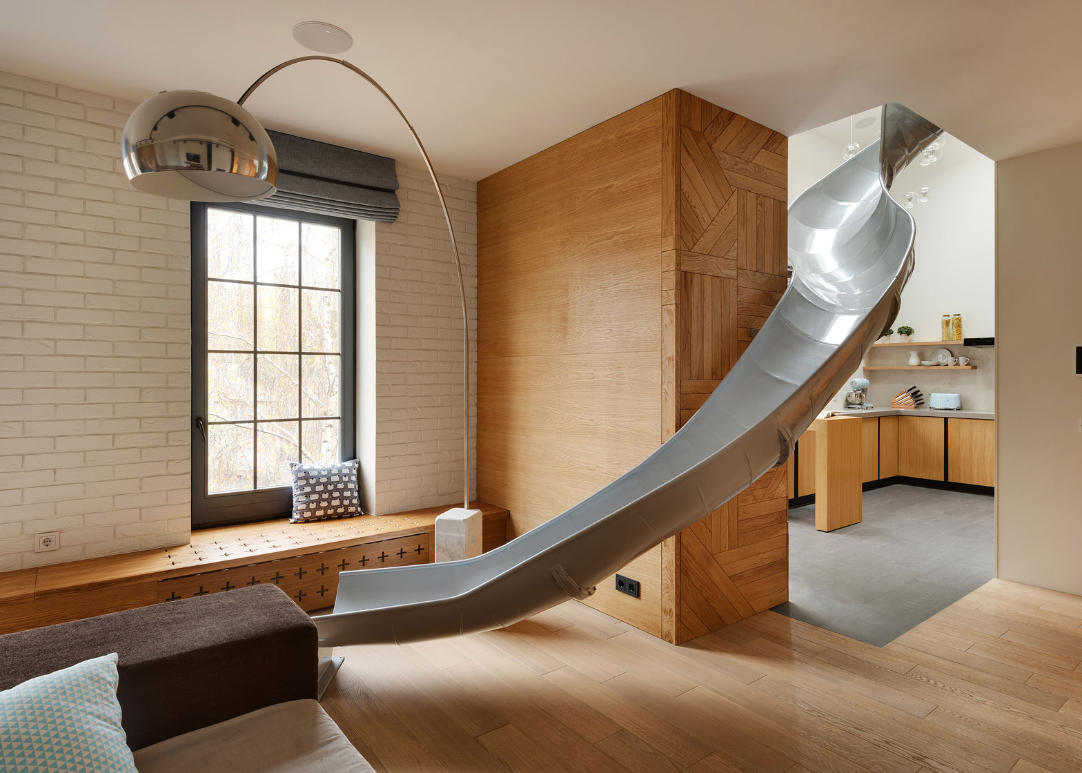 Apartment with a slide by KI Design Studio