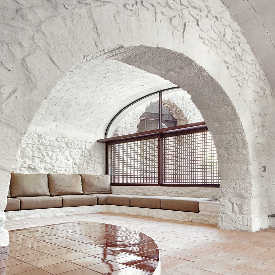 Whitewashed stone and glazed tiles feature in renovated Spanish farmhouse by Arquitectura-G