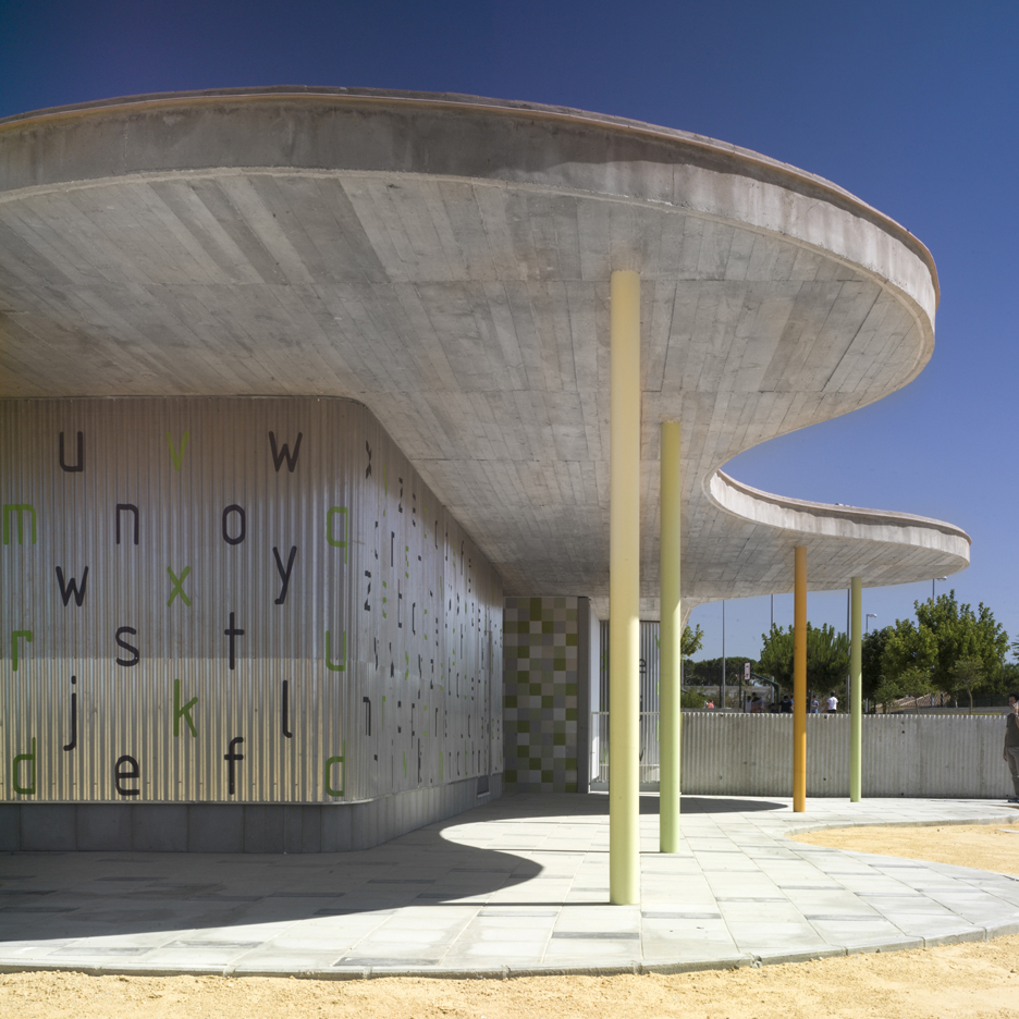 Wavy concrete roof shelters corrugated metal kindergarten by Gabriel Verd in Spain