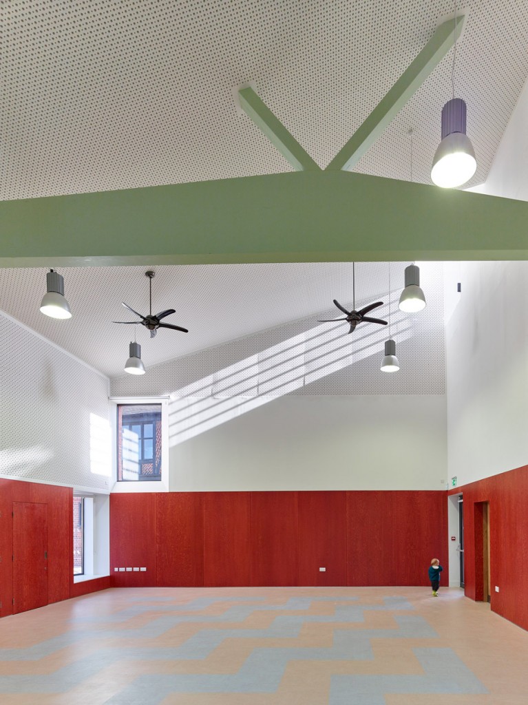 The Green community centre by AOC features herringbone-patterned ...