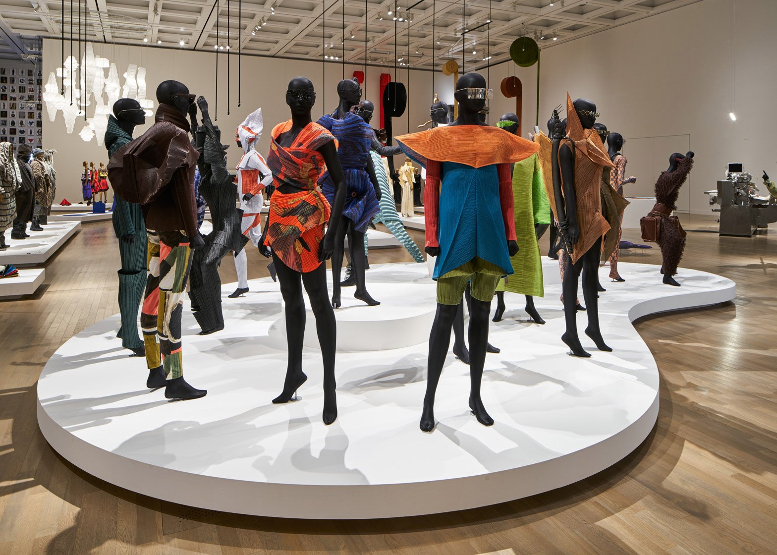 Image of mannequins wearing garments by Issey Miyake