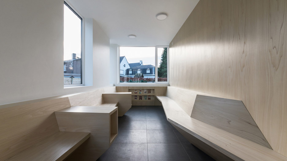 Joshua Florquin uses angular joinery to create bespoke furnishings for doctor's surgery in Maldegem, Belgium