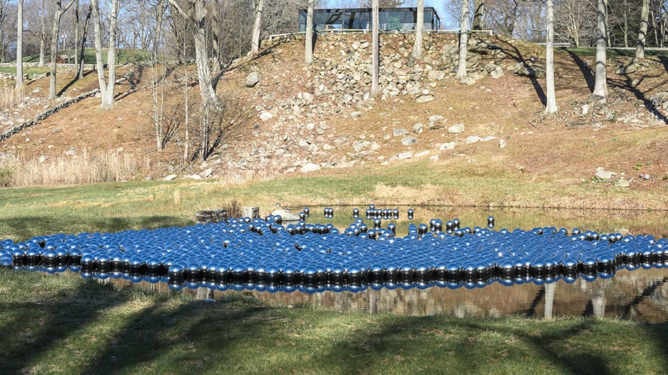 Narcissus Garden sculpture of mirrored spheres by Yayoi Kusama installed at Philip Johnson's Glass House in Connecticut